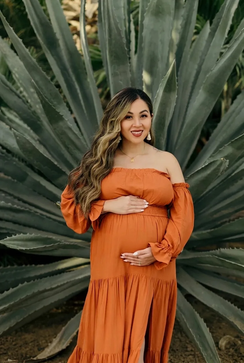 Sculptural agaves framing an elegant maternity portrait in San José del Cabo