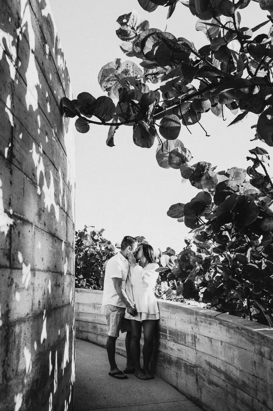 A couple laughing together naturally during a Cabo San Lucas couples session by Ana Badillo
